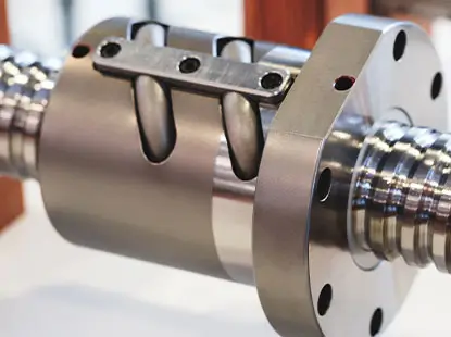 Precision metal component being machined on industrial equipment