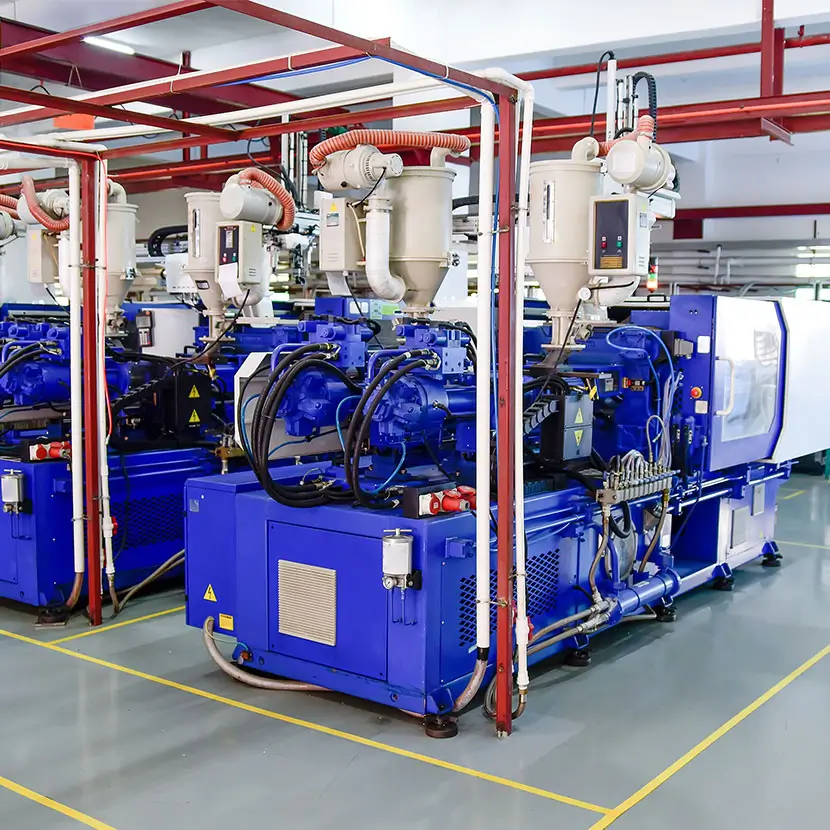 Industrial chemical processing equipment with blue machinery and piping systems